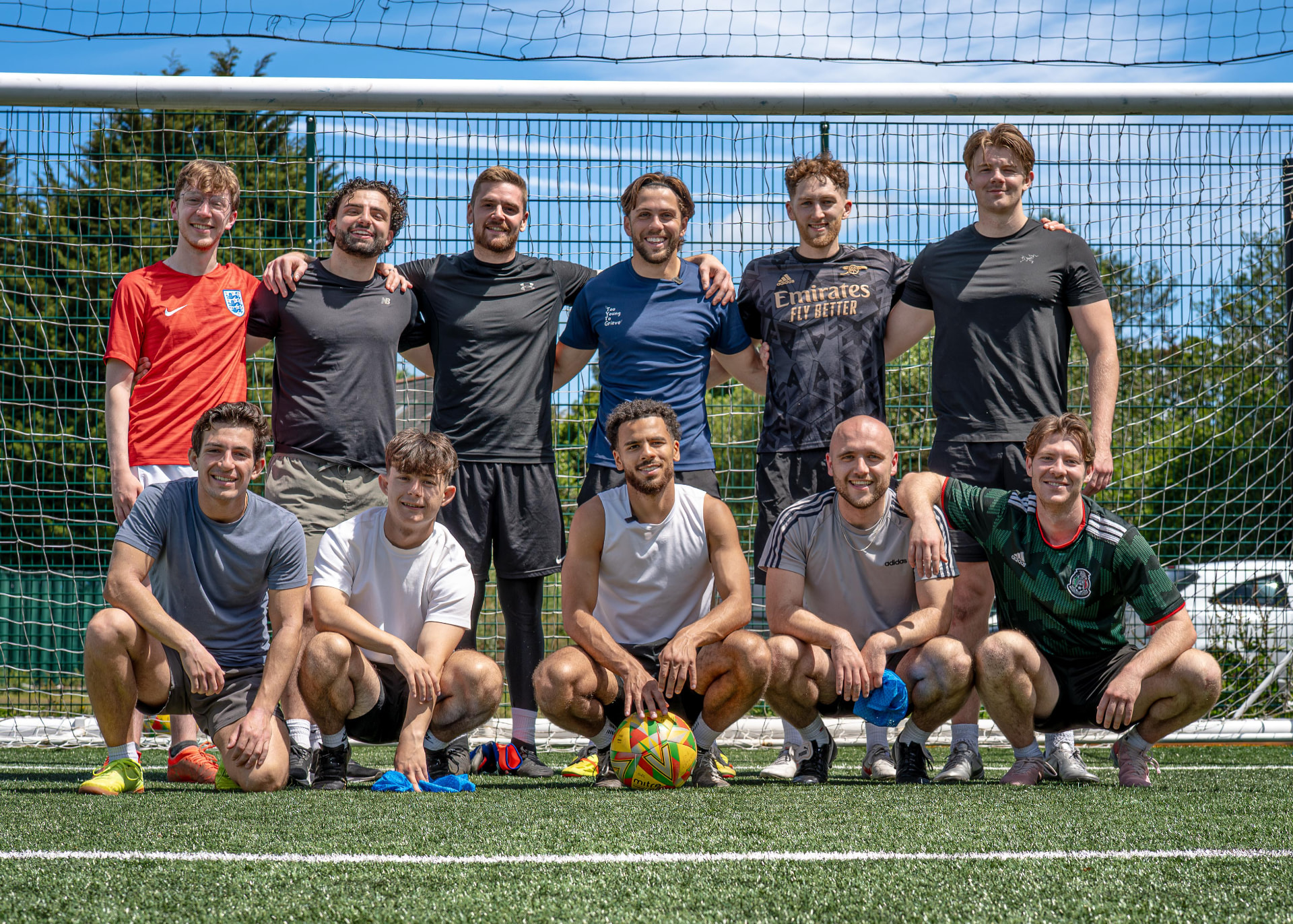 Too Young To Grieve community football team together on the pitch